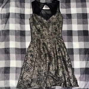 Gold and black dress with sheer neck line